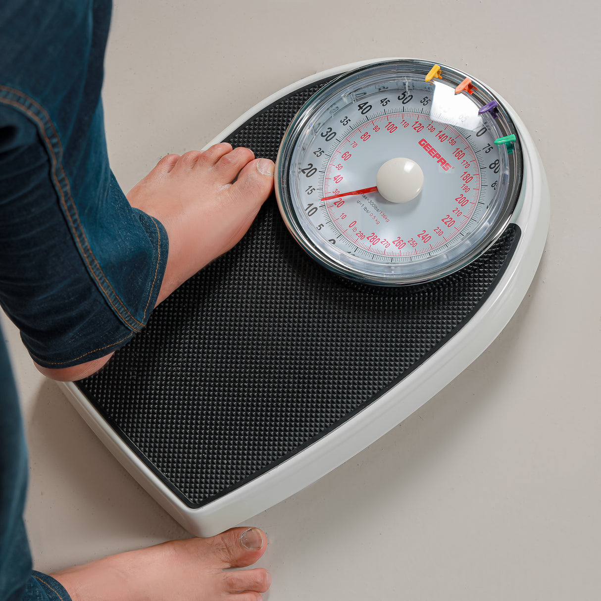 Geepas Mechanical Personal Scale- GBS46528UK/ 136KG Capacity, High Precision Dial, Metal Body, Leather Surface, Step-On Tech, Multi-Purpose Use, White & Black, 2Y Warranty