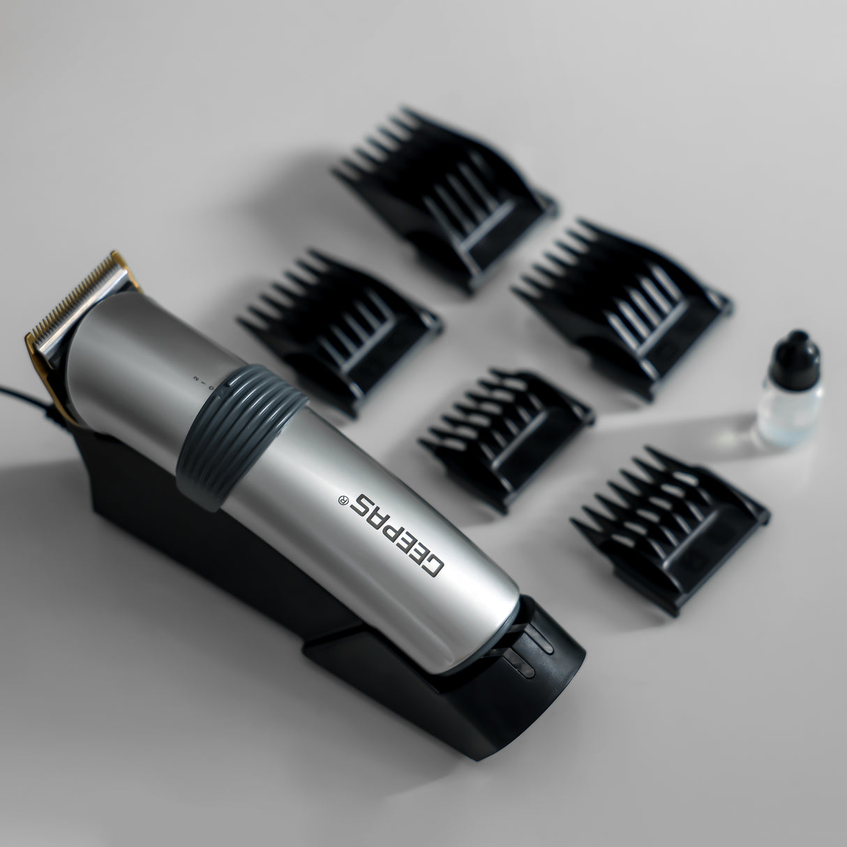 Geepas GTR8684 Professional Hair Clipper | Cordless & Rechargeable Trimmer with Stainless Steel Blade |Adjustable Razor | 5 Combs | Brush, Oil & 8-Hour Charging